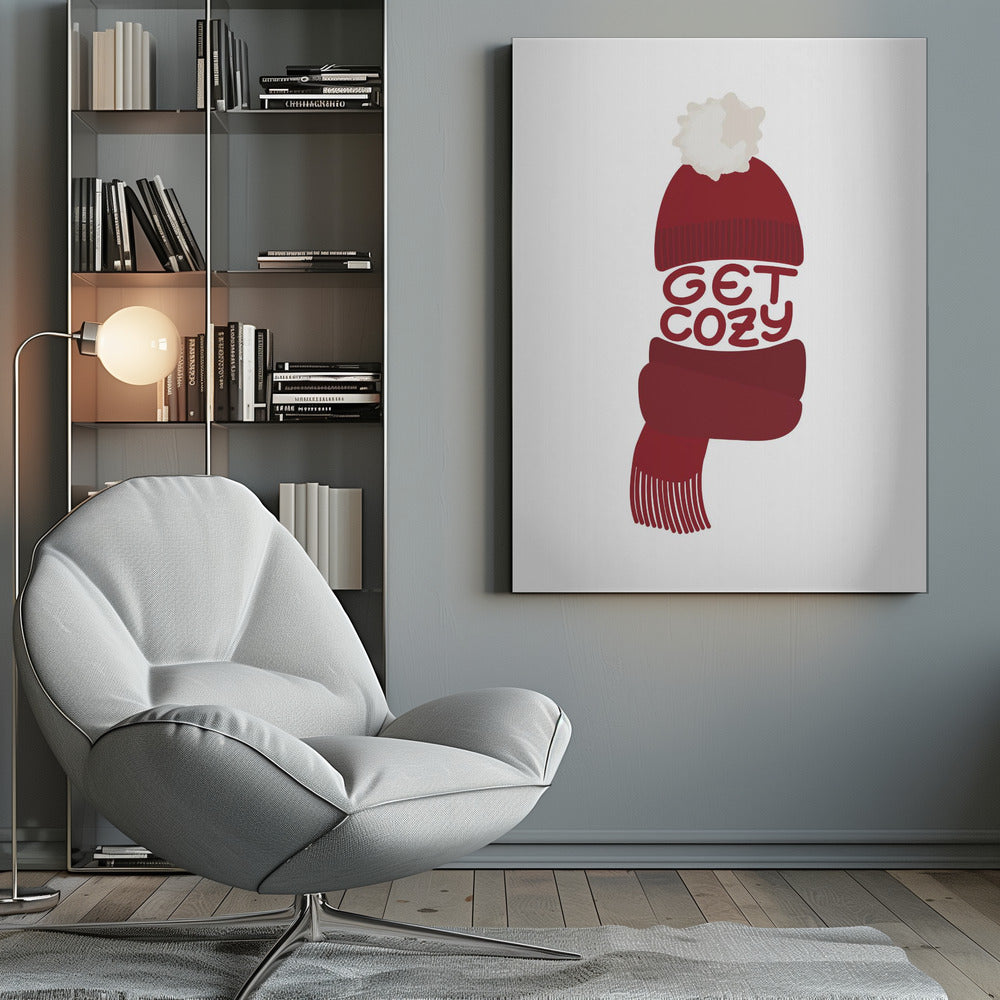 A minimalist illustration of a red knit beanie with a white pom-pom and a matching red scarf. The words 'GET COZY' are written in a playful font, forming the middle section of the hat and scarf against a plain white background, enclosed in a black frame. Poster
