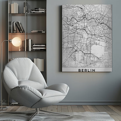 A minimalist black and white poster of a street map of Berlin, Germany. The map's intricate network of roads and waterways is depicted with black lines on a white, slightly textured background. The artwork is enclosed in a simple black frame, with the word 'BERLIN' printed in bold, black capital letters at the bottom center. Wall Art