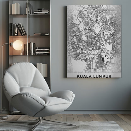 A minimalist black and white street map of Kuala Lumpur, displayed in a black frame. The map shows a detailed network of roads and city blocks on a textured white background. The name "KUALA LUMPUR" is printed in a bold, modern font at the bottom. Decor