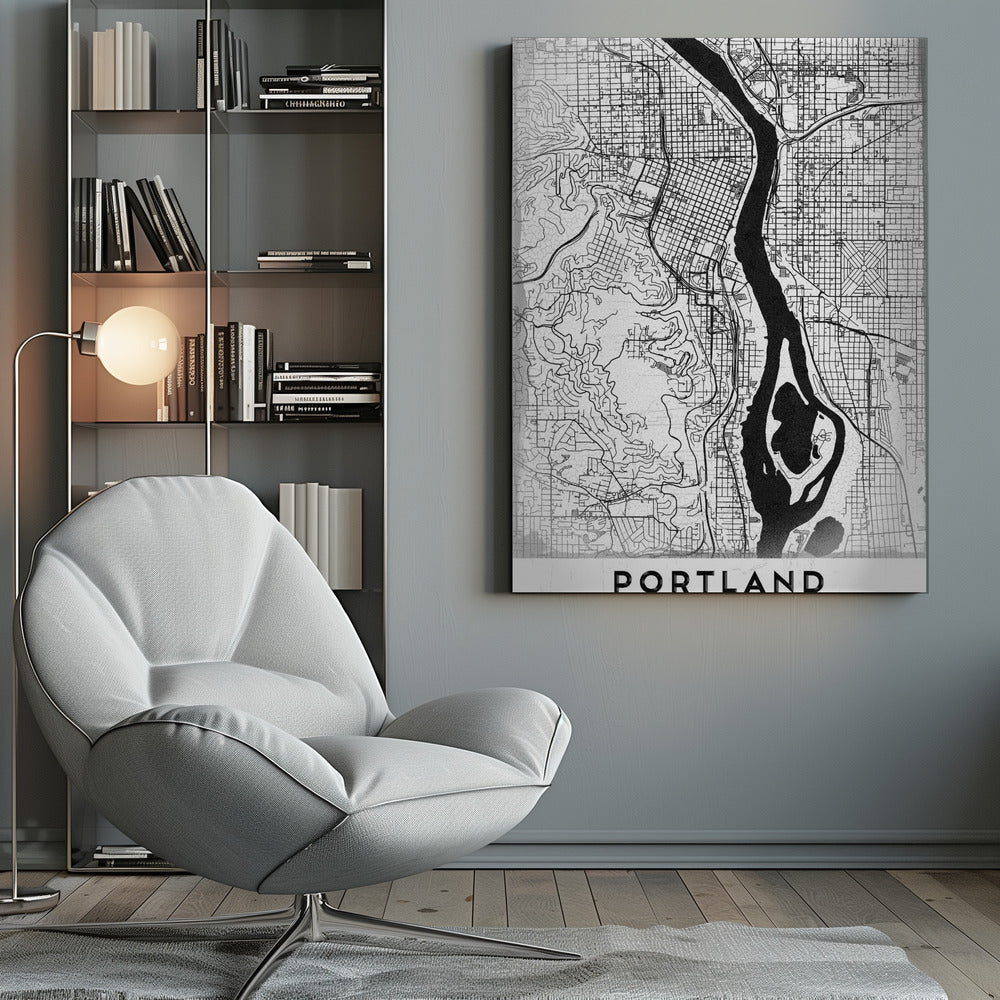 A framed, black and white street map of Portland, Oregon. The map is stylized with black lines for streets on a textured white background, and the Willamette River is depicted in solid black. The word 'PORTLAND' is written in a bold, black, sans-serif font at the bottom. Decor