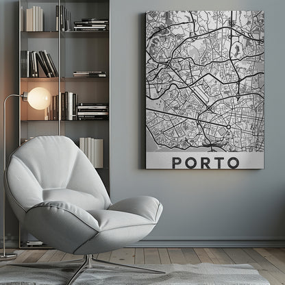 A minimalist black and white art print of a city map of Porto, Portugal, enclosed in a black frame. The map features a stylized network of roads and city blocks, with some areas shaded in grey or with a dot pattern. The word 'PORTO' is printed in large, bold, black capital letters at the bottom on a white background. Print