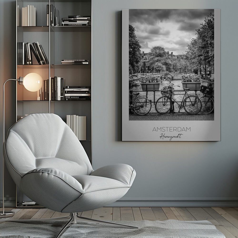 A black and white poster of the Herengracht canal in Amsterdam. In the foreground, two bicycles are parked by a railing with flower boxes. In the background, there's a classic view of the canal with a bridge, canal houses, and boats under a cloudy sky. The bottom of the poster has text that reads 'AMSTERDAM Herengracht NEDERLAND'. Decor