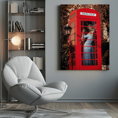 A couple in vintage clothing share a passionate kiss inside a classic bright red telephone booth. The woman is wearing a light blue dress, and the man wears a hat. The sign above the booth door reads 'NON STOP'. The setting appears to be outdoors in autumn. Wall Art