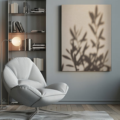 A framed photograph featuring the soft, out-of-focus shadow of a leafy plant projected onto a warm, beige-colored wall. The image has a minimalist and tranquil aesthetic, focusing on the interplay of light and shadow. Wall Art
