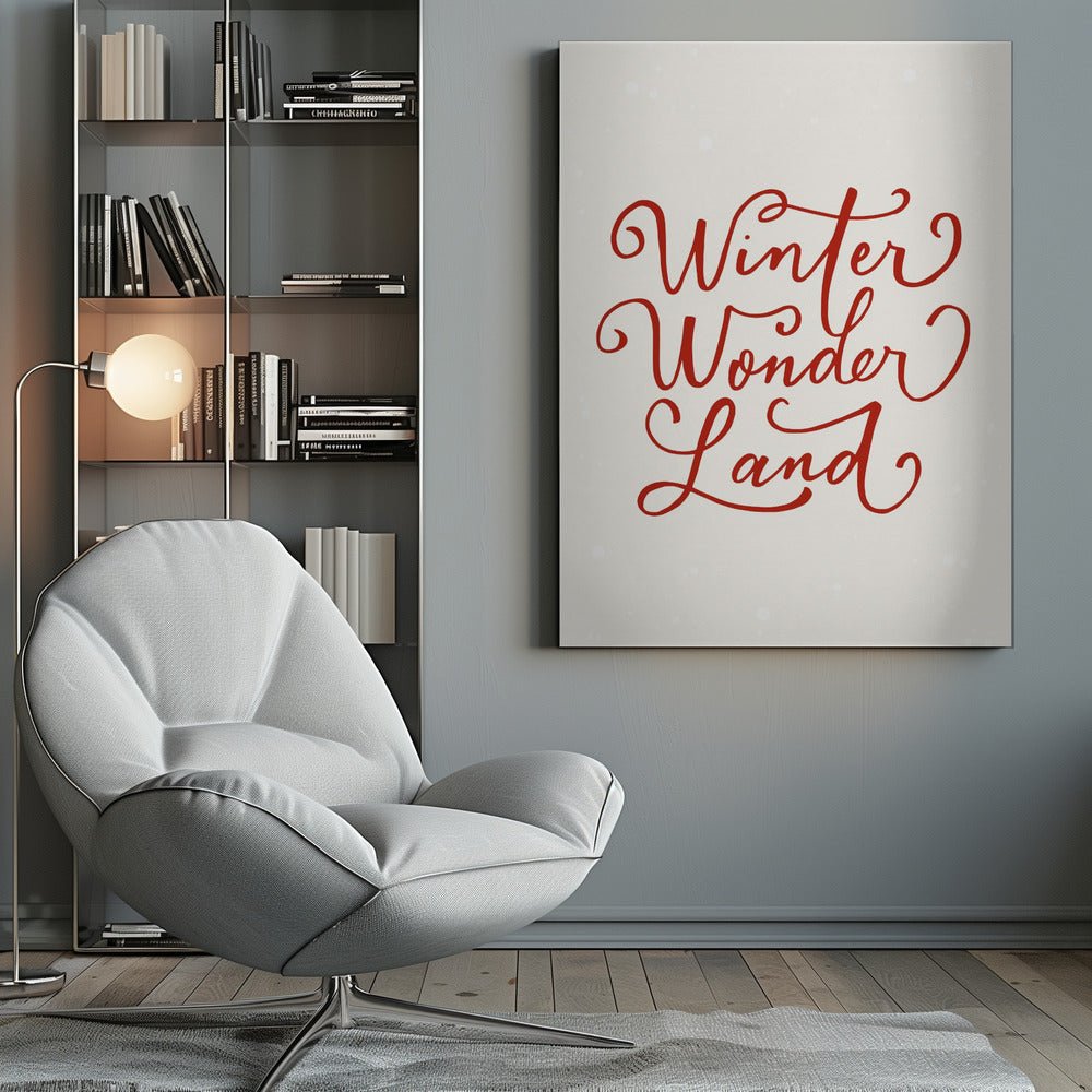 A holiday-themed art print with the words 'Winter Wonder Land' written in a flowing red script font on a speckled, off-white background, all enclosed within a simple black frame. Artwork