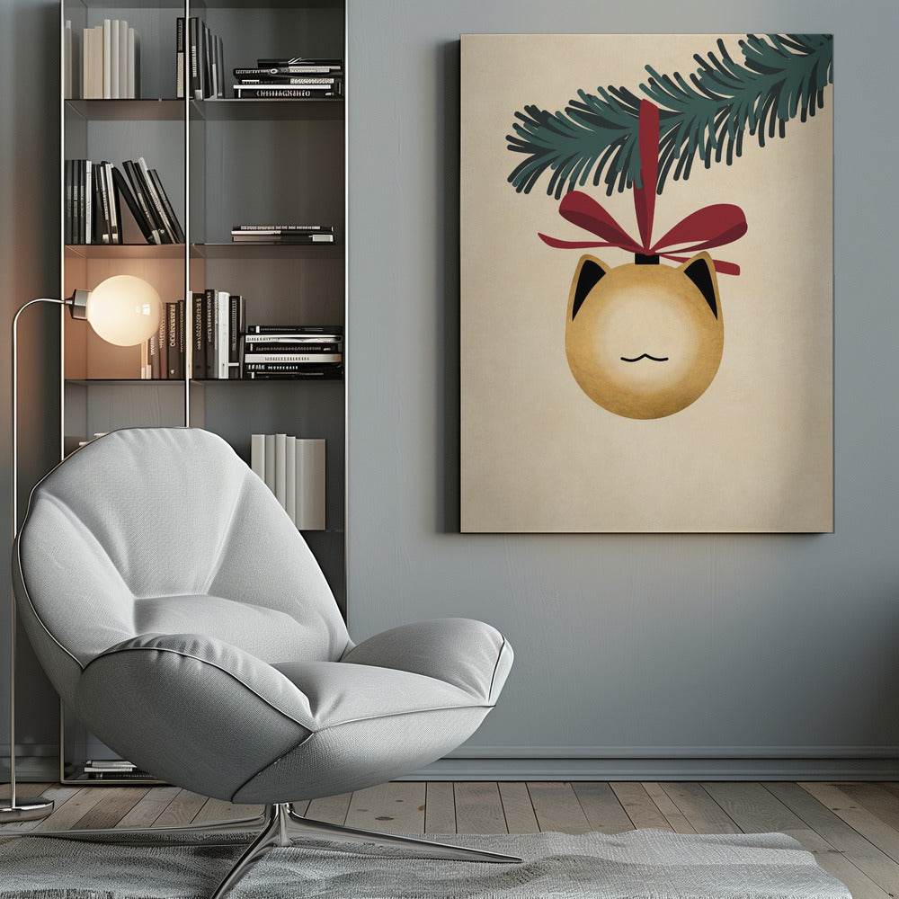 A minimalist illustration of a golden-yellow Christmas ornament shaped like a cat's head, complete with black-tipped ears and a simple line mouth. It hangs from a dark green pine branch by a festive red ribbon, all set against a textured beige background and framed in black. Artwork
