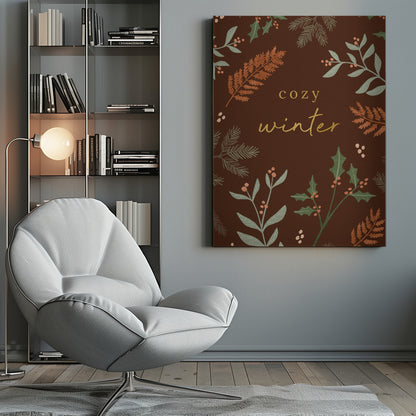 A warm, illustrative poster with a dark brown background featuring the words 'cozy winter' in gold script at the center. The text is framed by a wreath of winter botanicals, including holly, pine needles, and ferns in shades of green and burnt orange. Print