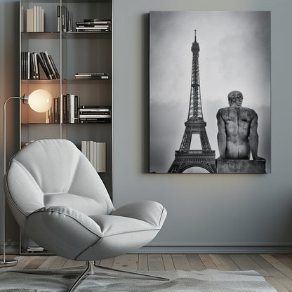 A black and white photograph capturing a contemplative scene in Paris, with the back of a seated, muscular male stone statue in the foreground looking towards the iconic Eiffel Tower which stands tall against a cloudy sky. Print