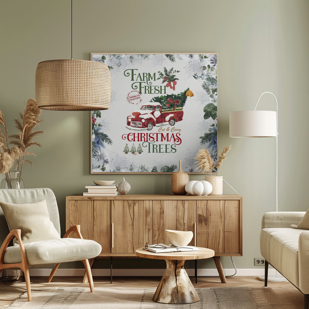 A vintage-style Christmas art print in a light wood frame. It features a watercolor illustration of a classic red pickup truck carrying a Christmas tree, with snow on its hood and roof. The text reads 'Farm Fresh Cut & Carry Christmas Trees' in festive green and red fonts. The background is white with a decorative border of frosted greenery and snowflakes. Wall Art