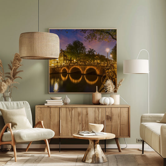 An idyllic nightscape view of Keizersgracht canal in Amsterdam, featuring illuminated buildings reflecting on the water under a dark sky. Wall Art