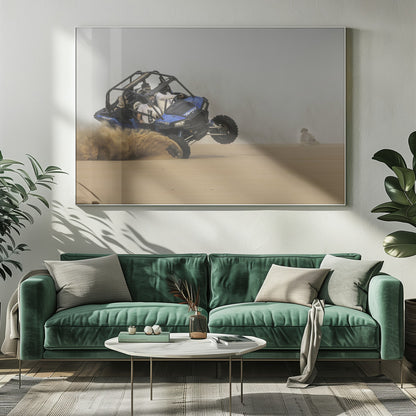 A framed action shot of a blue dune buggy with several passengers making a sharp turn in the desert, kicking up a large cloud of sand and lifting its front wheel off the ground. Wall Art