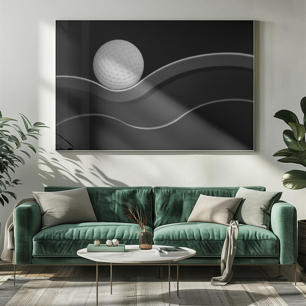 A framed, minimalist black and white photograph of a golf ball resting on a gracefully curving gray surface against a solid black background. Wall Art