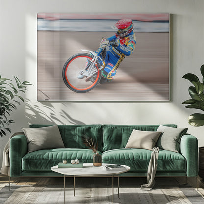 A speedway motorcycle racer in a blue and yellow suit with a red helmet leans sharply into a turn on a dirt track, with motion blur in the background conveying a sense of high speed. Print