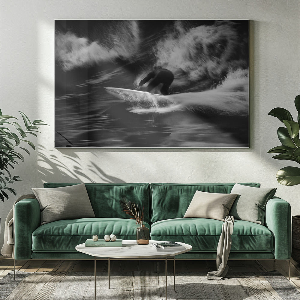 A dynamic black and white action photograph of a surfer in a dark wetsuit, crouched low on a surfboard while riding a powerful wave. Motion blur captures the speed and energy of the moment, with white water spray exploding around the surfer against the dark ocean. Print