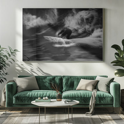 A dynamic black and white action photograph of a surfer in a dark wetsuit, crouched low on a surfboard while riding a powerful wave. Motion blur captures the speed and energy of the moment, with white water spray exploding around the surfer against the dark ocean. Print