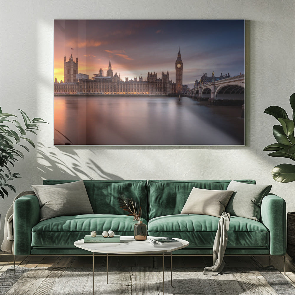 A framed photograph of the Houses of Parliament and Big Ben in London at sunset, with a dramatic orange and purple sky reflecting in the calm waters of the River Thames. Artwork