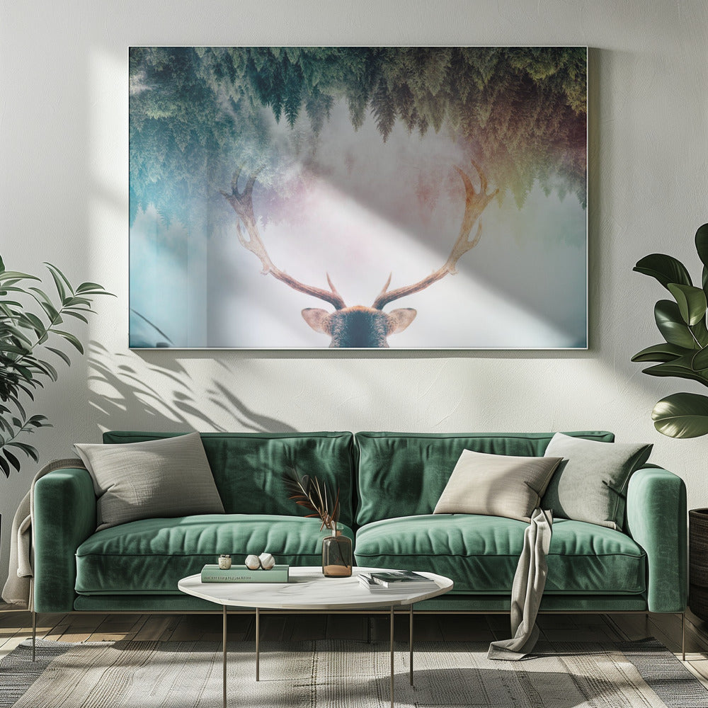 A surreal double-exposure artwork featuring the back of a deer's head with large antlers, blended with an image of a misty pine forest. The forest is reflected above the antlers against a soft, pastel-colored background, all enclosed in a silver frame. Print