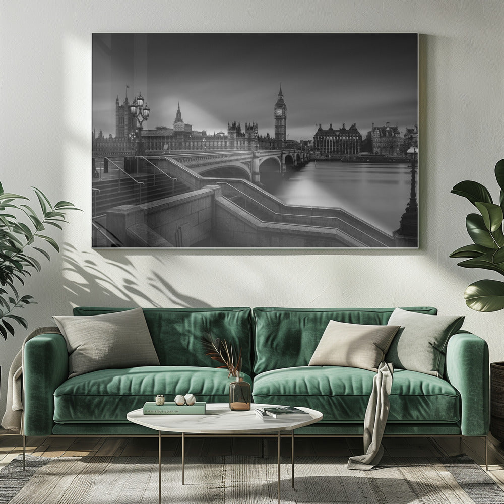 A framed, black and white, long-exposure photograph of the London skyline featuring the Houses of Parliament and the Big Ben clock tower across the River Thames. In the foreground, stone steps lead down towards Westminster Bridge, and the water of the river is smooth and reflective under a dark, cloudy sky. Print