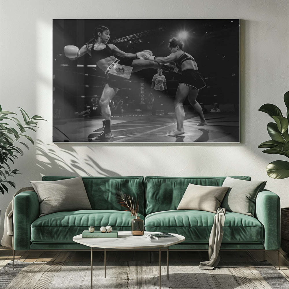 A dramatic black and white action photograph of two female kickboxers in a ring. One fighter, airborne, executes a high kick that connects with the other fighter's gloves, who is bracing for the impact. A referee stands in the background under bright arena lights. Poster