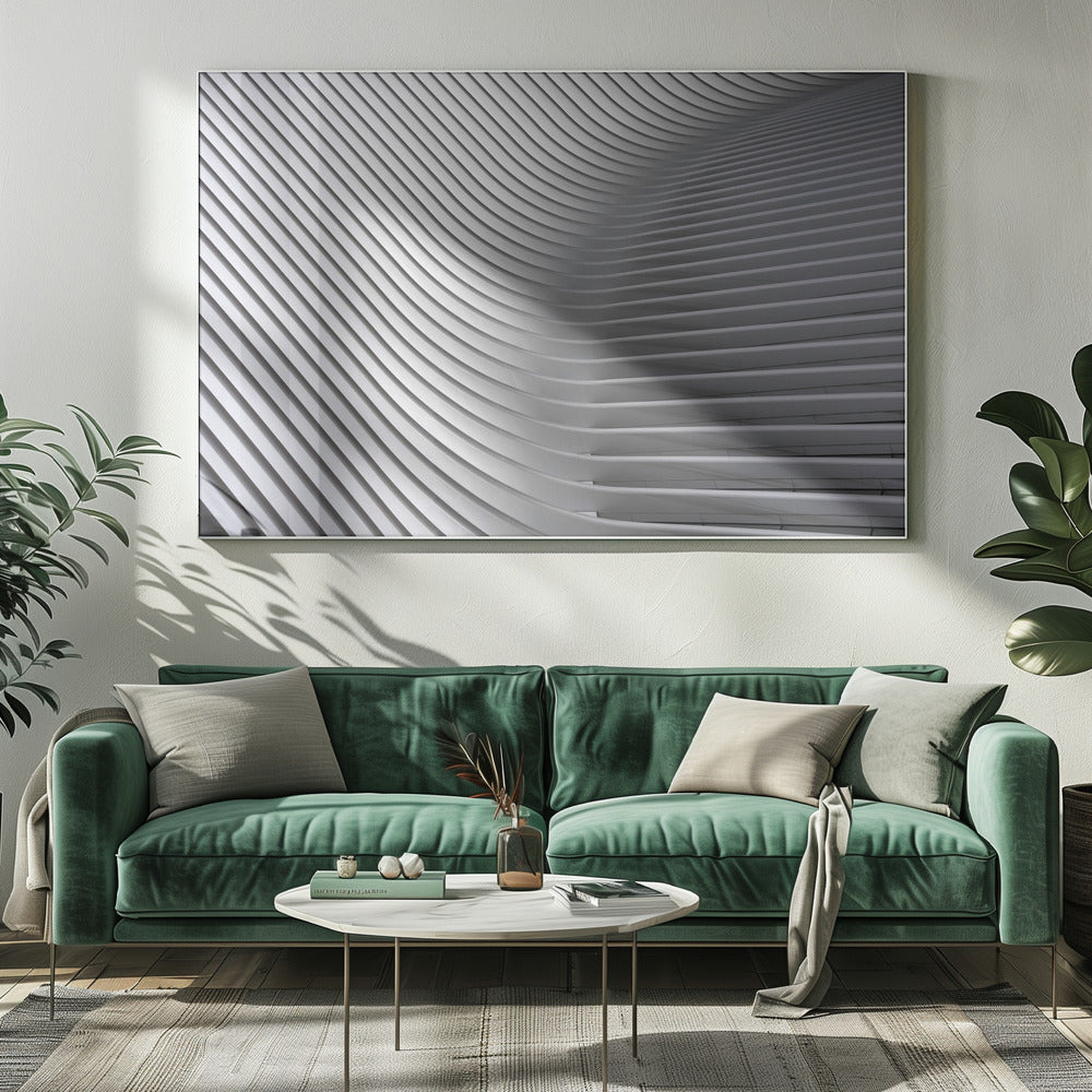 A framed, close-up, abstract photograph of a modern architectural structure. Parallel white ribs curve and undulate across the frame, creating a sense of movement and rhythm through the interplay of light and shadow. Artwork