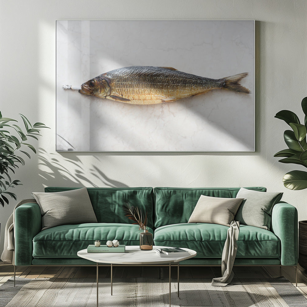 A surreal photograph of a whole smoked fish with a cigarette butt in its mouth, laying horizontally on a white marble surface, all within a silver frame. Wall Art