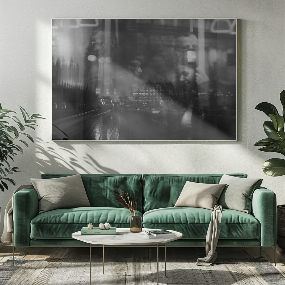 A moody black and white double exposure photograph showing a rainy London street at night with Big Ben, overlaid with the faint reflections of people inside a moving vehicle like a bus. The image has a dreamy, layered effect and is displayed in a silver frame. Print
