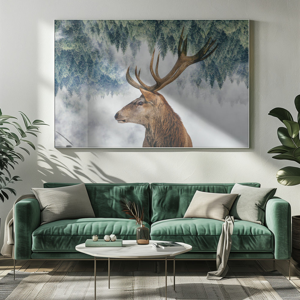 A surreal double-exposure style image featuring the profile of a brown stag with large antlers. The top half of the image is an inverted green pine forest that blends into a foggy, light grey background surrounding the deer. The entire artwork is presented within a silver frame. Poster