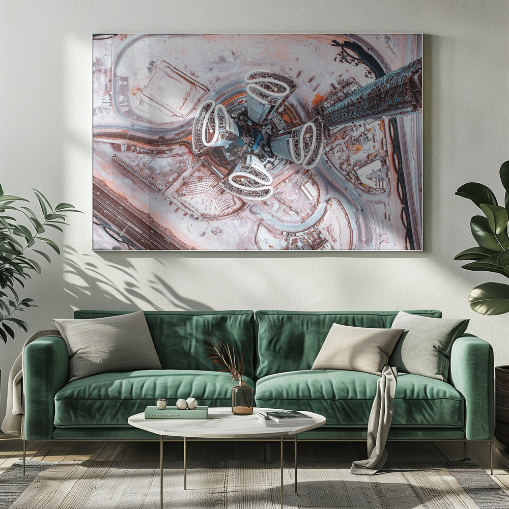 A dizzying top-down aerial photograph of five futuristic, petal-shaped skyscrapers surrounding a central turquoise pool. The surrounding urban landscape is a mix of dusty pink construction sites and curving roads, creating a surreal and abstract cityscape. Wall Art