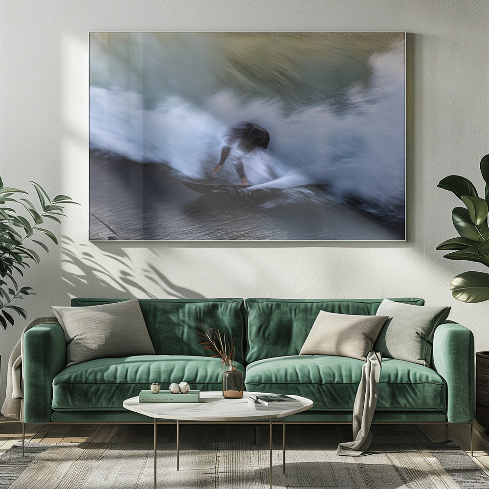 An abstract, motion-blur photograph of a surfer in a black wetsuit, crouched on their board and surrounded by a dynamic swirl of white sea spray and dark blue water, all enclosed in a silver frame. Artwork