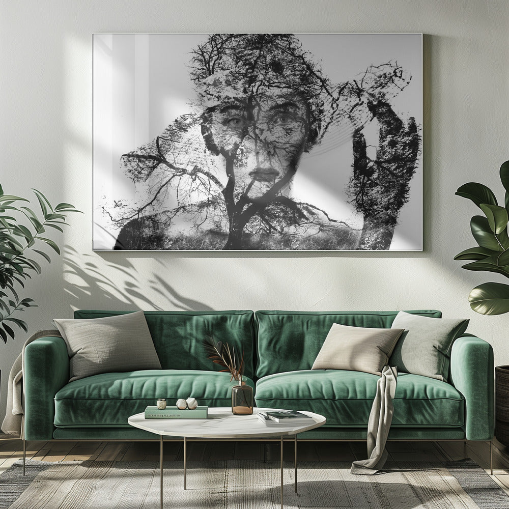 A surreal black and white double exposure artwork in a silver frame. The image combines a close-up portrait of a person's face with the intricate silhouette of bare, branching trees against a white background, creating a complex and thought-provoking visual. Poster