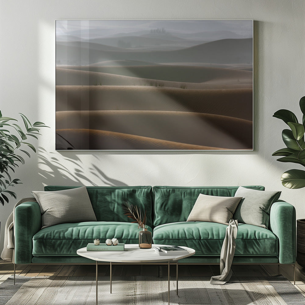 A framed photograph of a serene desert landscape, with layers of rolling sand dunes creating a sense of depth. Dark brown dunes in the foreground give way to lighter, hazy dunes and hills in the misty background. Print