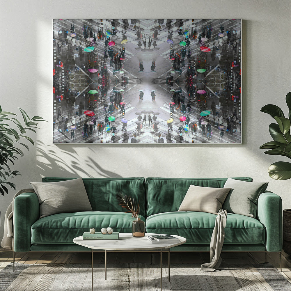 A symmetrical, kaleidoscopic abstract artwork created from an aerial view of a rainy city intersection. The mostly black and white image features pops of vibrant color from numerous umbrellas held by pedestrians crossing the street, all framed in a textured silver border. Artwork