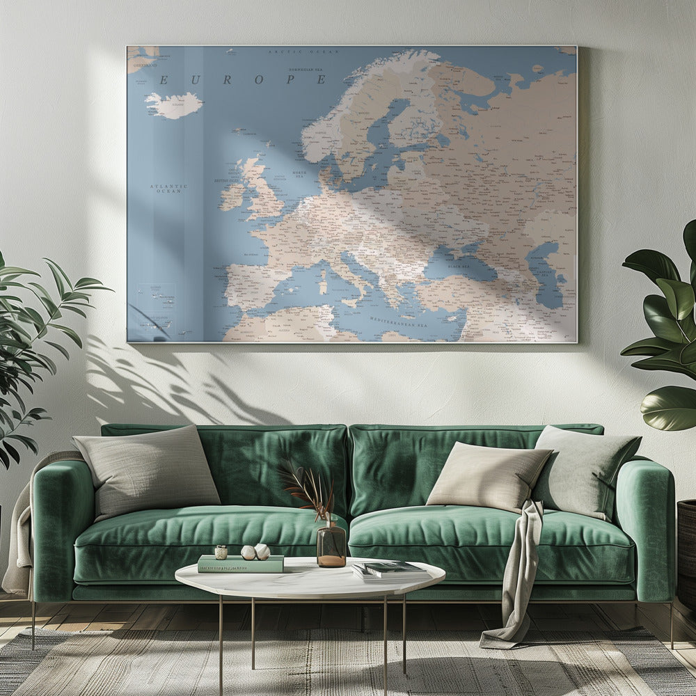 A detailed, framed map of Europe with a muted color palette. The oceans and seas are a soft blue, while the countries are various shades of beige and tan. Text labels for countries, cities, and bodies of water are clearly visible across the map. The map is housed in a simple silver-gray frame. Poster