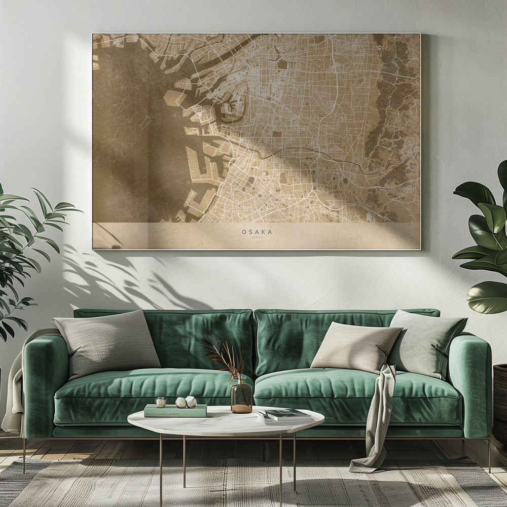 A framed, stylized map of Osaka, Japan, presented in monochrome brown and beige tones. The city's streets and coastline are intricately detailed in thin white lines against a textured brown background for the water and a lighter beige for the land, all enclosed within a sleek silver frame. Poster