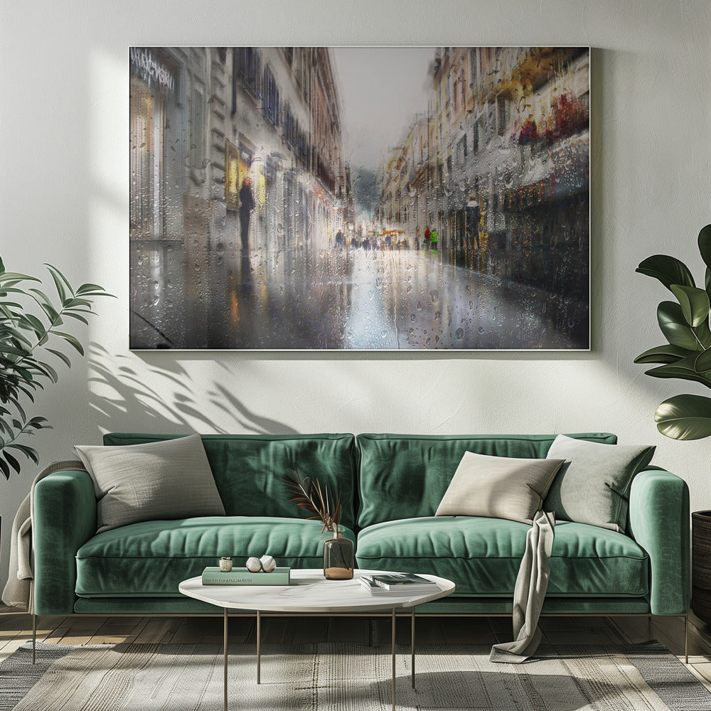 An impressionistic painting of a city street on a rainy day, viewed as if through a window covered in water droplets. The scene is blurred and atmospheric, with the wet pavement reflecting the muted colors of the buildings and distant figures. The artwork is presented in a silver frame. Decor