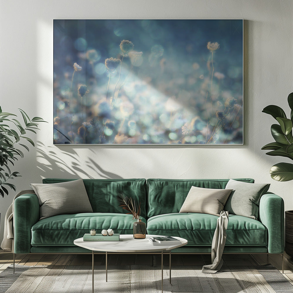 A dreamy, soft-focus photograph of dried wildflowers silhouetted against a shimmering background of blue and white bokeh lights, creating a magical and ethereal atmosphere. The artwork is presented in a brushed silver frame. Wall Art