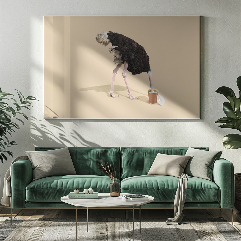 A humorous and surreal image of a black and white ostrich with its head buried inside a disposable coffee cup, set against a plain beige background and enclosed in a silver frame. Decor