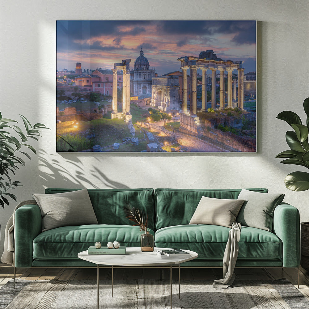 A scenic photograph of the ancient Roman Forum in Rome, Italy, at dusk. The ruins, including prominent columns and arches, are illuminated by warm lights, contrasting with the deep blue and vibrant pink of the sunset sky. Wall Art