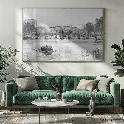 A framed black and white pencil drawing of the Magere Brug, a famous bridge in Amsterdam. The drawbridge is depicted over a canal with a boat in the foreground, creating a classic European city scene. Wall Art