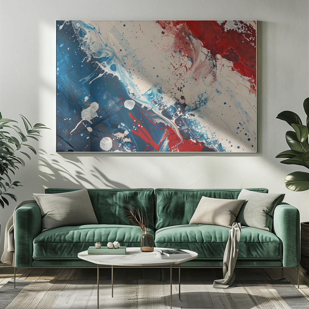 A close-up of an abstract painting in a silver frame, featuring a dynamic composition of red, white, and blue. Thick strokes of paint are splattered and swirled across the canvas, with a large area of deep blue on the left, a bold patch of bright red on the upper right, and a field of off-white in the middle. The piece has a textured, energetic quality. Artwork
