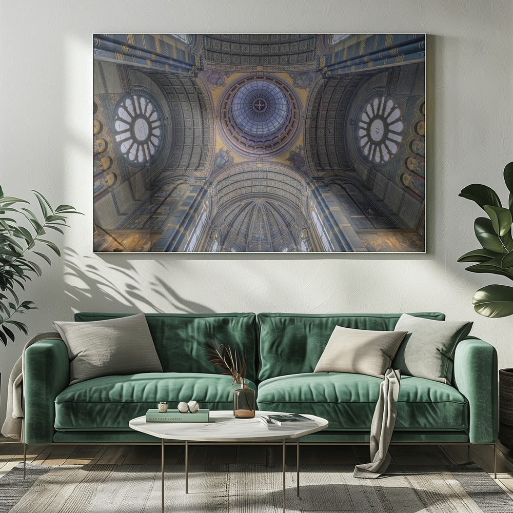 An upward-looking view of the highly ornate vaulted ceiling of a grand cathedral, featuring a central glass dome, large rose windows, and intricate gold and blue details, all framed in silver. Poster