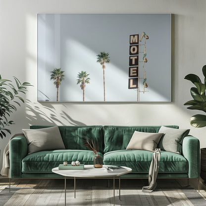 A minimalist photograph featuring three tall palm trees and a vertical black and white 'MOTEL' sign against a pale blue sky. Affixed to the sign's pole are several figures of women in green swimsuits, posed as if diving in a synchronized formation. Poster