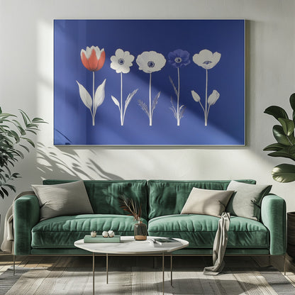 A framed art print showing five flowers in a horizontal line against a vibrant royal blue background. The flowers are illustrated in a graphic style, with one red tulip, one blue anemone, and three white anemones. The stems and leaves are depicted in white and grey tones. The artwork is enclosed in a silver frame. Poster