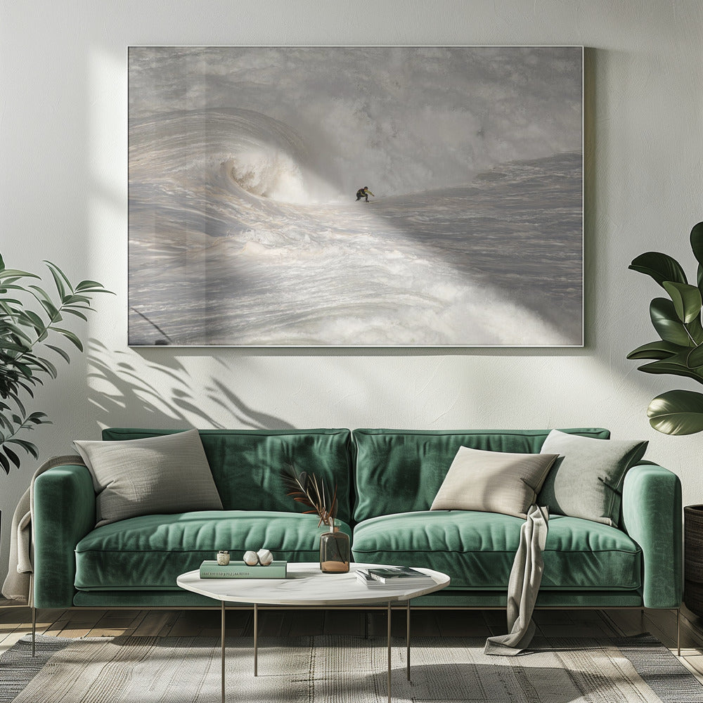 A framed photograph of a lone surfer dwarfed by a massive, powerful ocean wave. The water is a churning mass of white foam and spray, and the surfer is navigating the enormous swell. Print