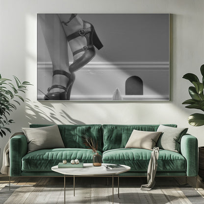 A black and white photograph showing the lower legs and feet of a woman wearing black high-heeled Mary Jane shoes. A tiny white mouse stands on its hind legs near a cartoonish mouse hole in the baseboard, looking up at the woman. Artwork