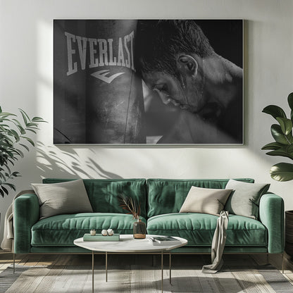 A dramatic black and white close-up photograph of an exhausted boxer resting his head against a heavy Everlast punching bag, with sweat dripping down his face and neck. Poster