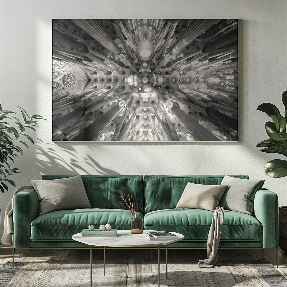 A framed black and white photograph captures the breathtaking, symmetrical ceiling of Gaudí's Sagrada Familia basilica, viewed directly from below. The massive columns rise and branch out like a forest canopy, creating a complex and mesmerizing architectural pattern of vaults, ribs, and skylights. Artwork