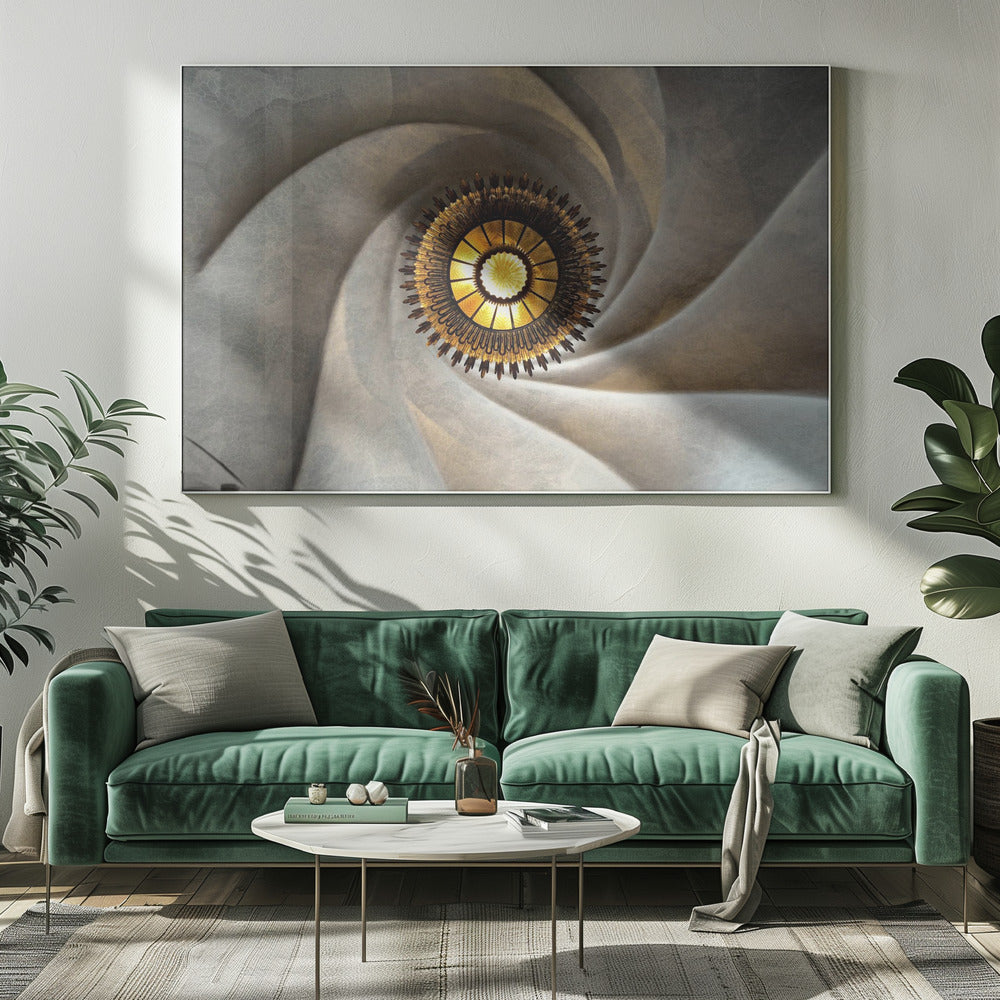 A low-angle, centered photograph looking up at an ornate, golden sunburst chandelier hanging from the vortex of a swirling, textured cream-colored ceiling, enclosed in a silver frame. Poster