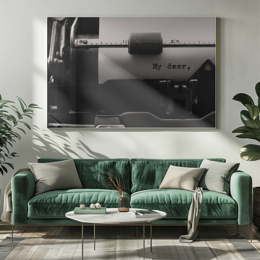 A close-up, black and white photograph of a vintage typewriter. A sheet of white paper is loaded, and the words 'My dear,' have just been typed, creating a sense of nostalgia and romance. The image is enclosed in a silver frame. Wall Art