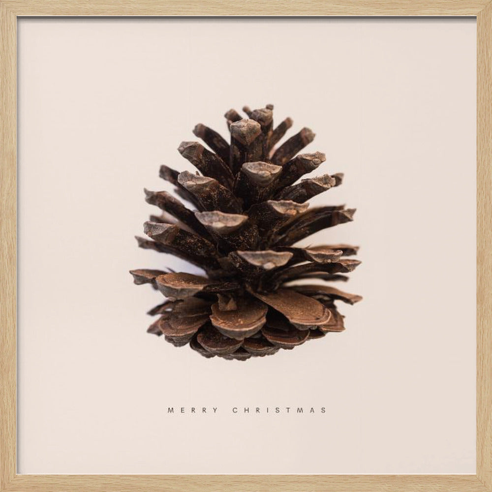A minimalist art print featuring a single brown pinecone centered on an off-white background. The words 'MERRY CHRISTMAS' are printed in a simple, spaced-out font below the pinecone. The entire image is enclosed in a light wood frame. Artwork